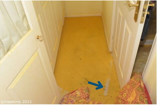 orange staining to carpet following a fire of a mattress